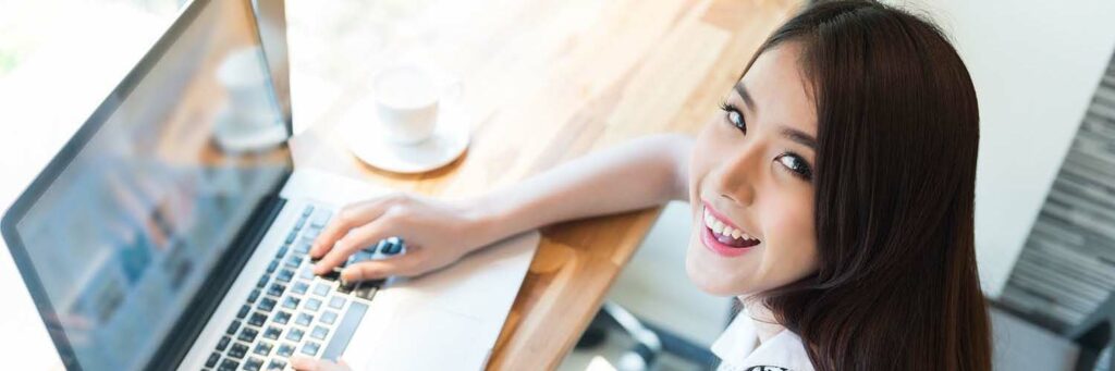 Beautiful business woman using a laptop computer