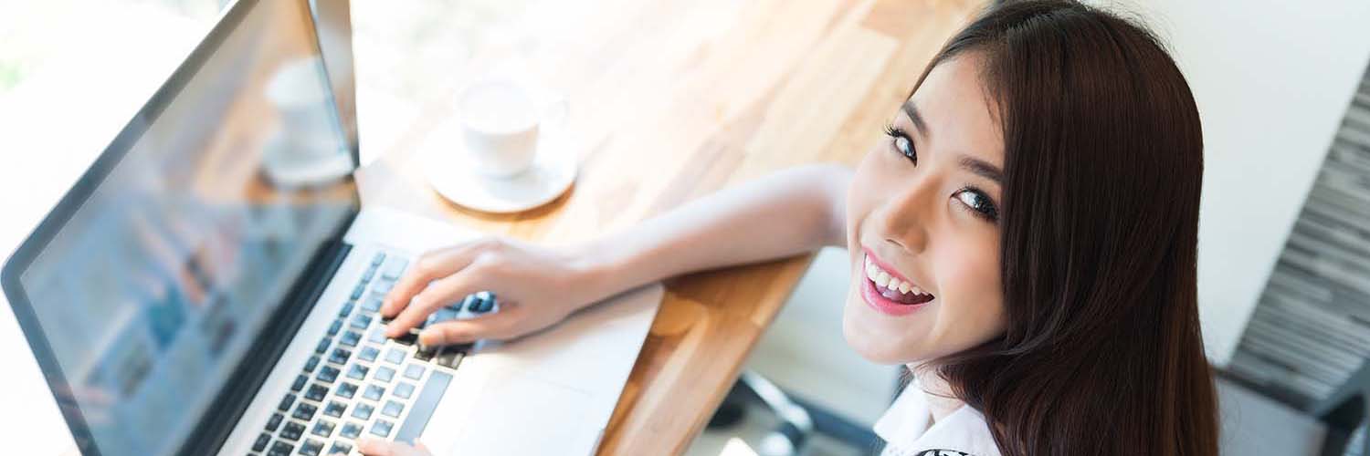 Beautiful business woman using a laptop computer
