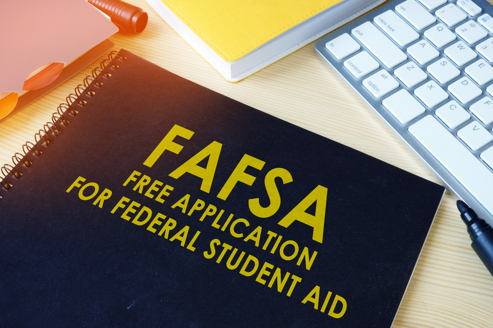 Dark blue folder with FAFSA Free Application for Federal Student Aid on the front