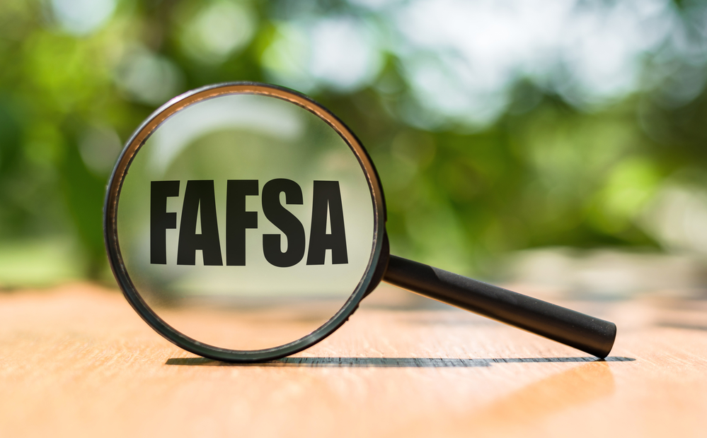 Magnifying glass with FAFSA being magnified