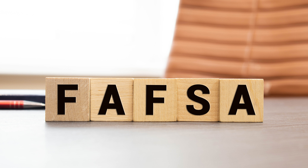 Wooden tile spelling out FAFSA