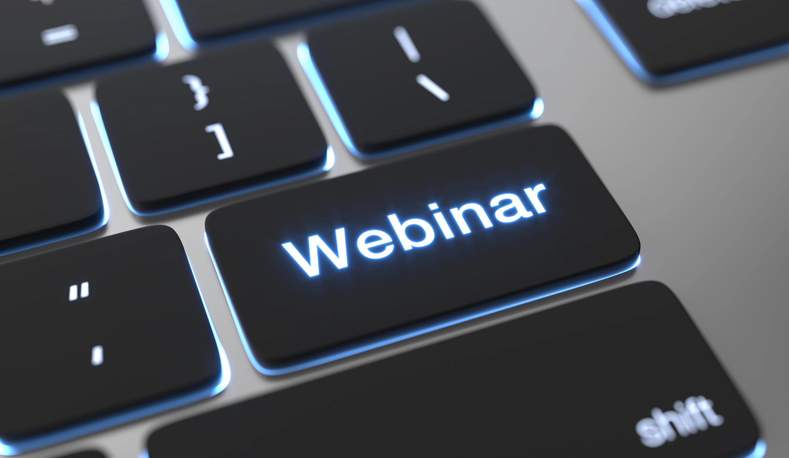 Portion of computer keyboard with the word "Webinar" in white on one of the black keys.